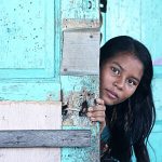 pmr_ashot_thumb_6 a teenage girl peers from behind a door.